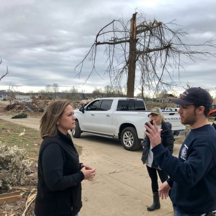 Kentucky Lt. Gov. Jacqueline Coleman assess the debris and damaged trees after a natural disaster.