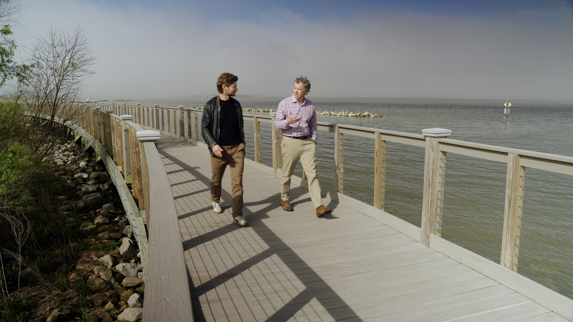 Bentley's Chief Storyteller Tomas Kellner (left) and Joey Coco, CEO of the engineering firm Forte and Tablada and founder of Digital-Twin walk along the spillway on the way to Baton Rouge.