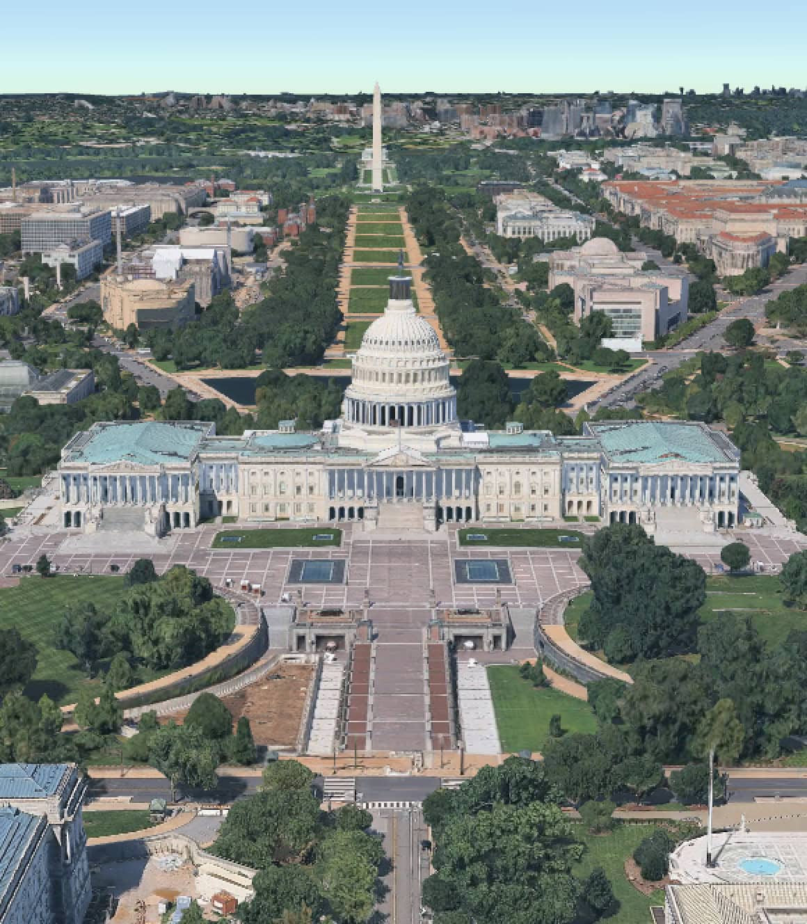 Aerial view of the United States Capitol building with the National Mall and Washington Monument in the background, offering a glimpse into America at 250 and the marvels that built a nation.
