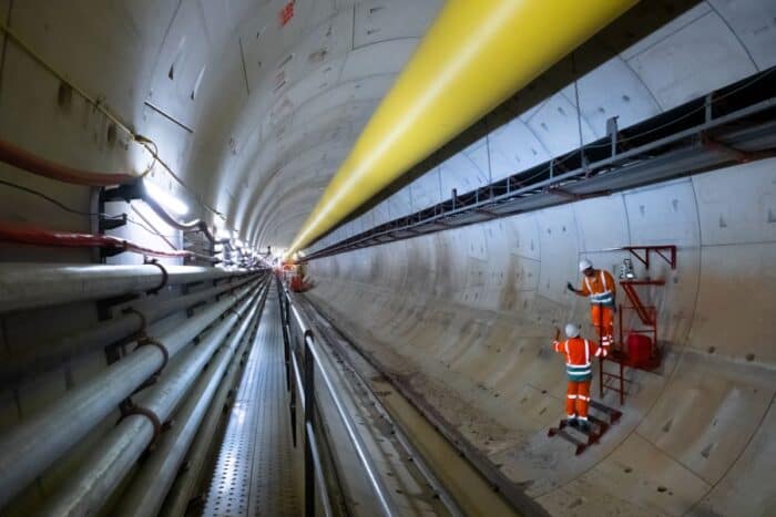 Construction workers inside a Thames Tideway tunnel, a 25k tunnel that will intercept, store and ultimately transfer sewage waste away from the River Thames.