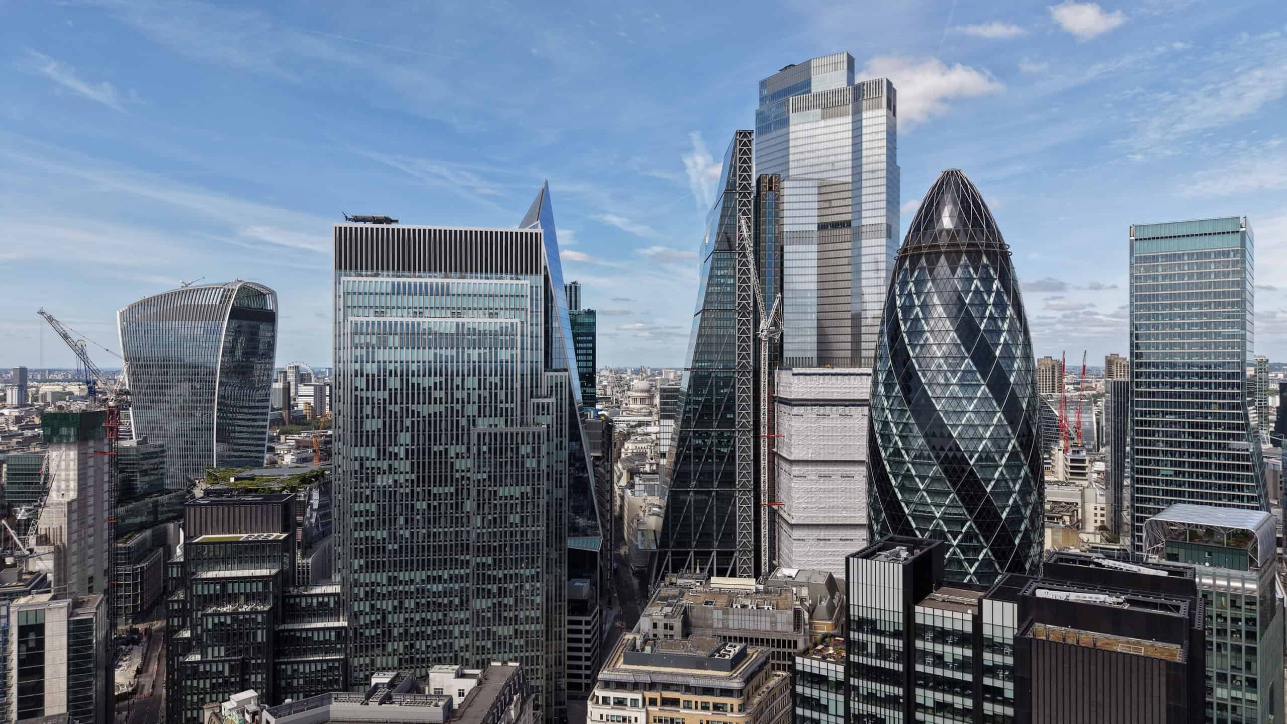 London's Financial District skyline featuring the iconic 30 St Mary Axe skyscraper known as The Gherkin.