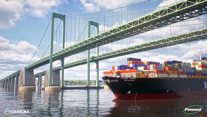 A large cargo ship loaded with colorful containers passes under a green suspension bridge on a sunny day, showcasing impressive infrastructure.