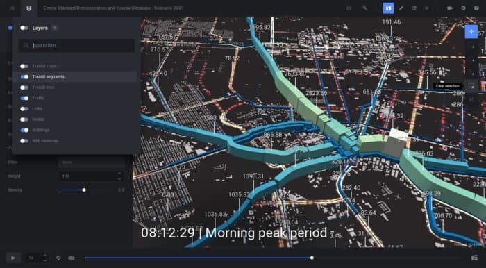 3D map with highlighted blue transit lines and green segments. An overlay shows data layers, and text reads "08:12:29 | Morning peak period.