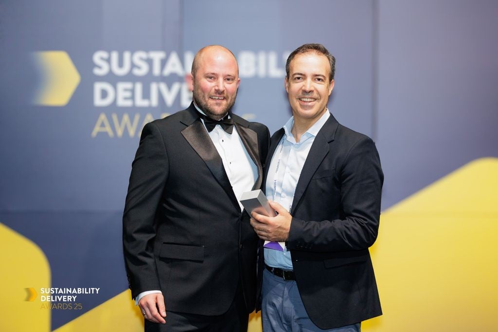 Bentley Systems&rsquo; Director of Sustainability, Rodrigo Fernandes (standing right), accepts a 2025 Sustainability Delivery Award from Ross Griffiths, Managing Director, Environment Analyst (standing left). (Image: Bentley Systems)