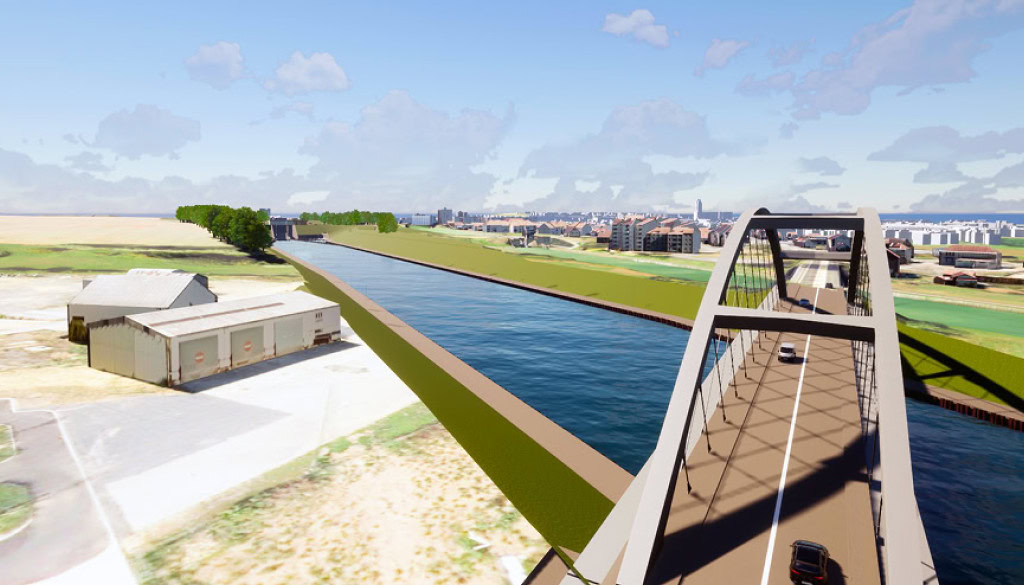 A bridge with vehicles crosses over a wide canal; surrounded by grassy banks, industrial buildings, and a distant cityscape—illustrating how smarter infrastructure projects connect regions under a partly cloudy sky.