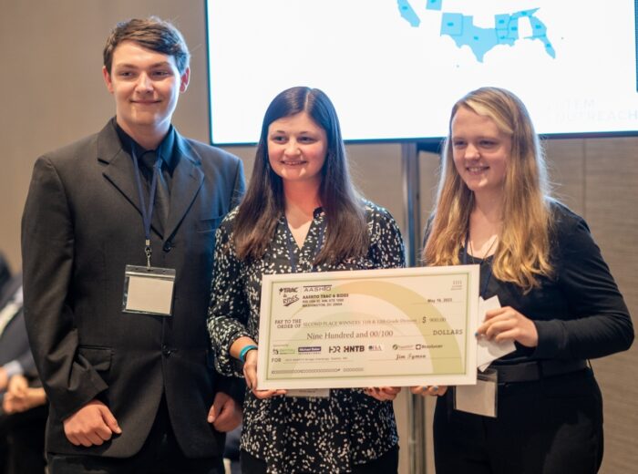 SAB Civil Engineering, second-place winners for 11th and 12th grades, receives a check from AASHTO. Image courtesy of Bentley Systems.