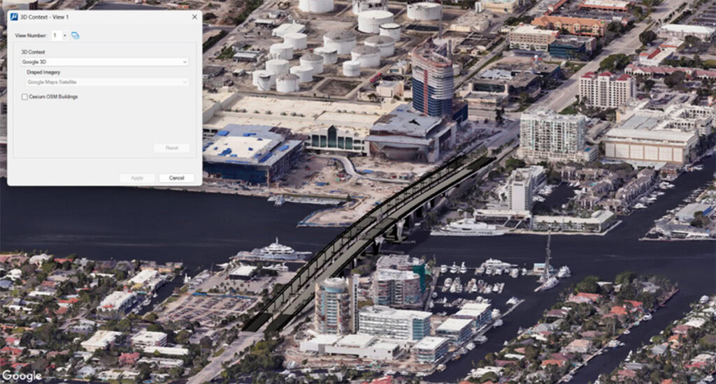 Aerial view of a waterfront city area with a bridge over a river, buildings, and roads, displayed in MicroStation 2026 with a map settings window open on the left side of the image.