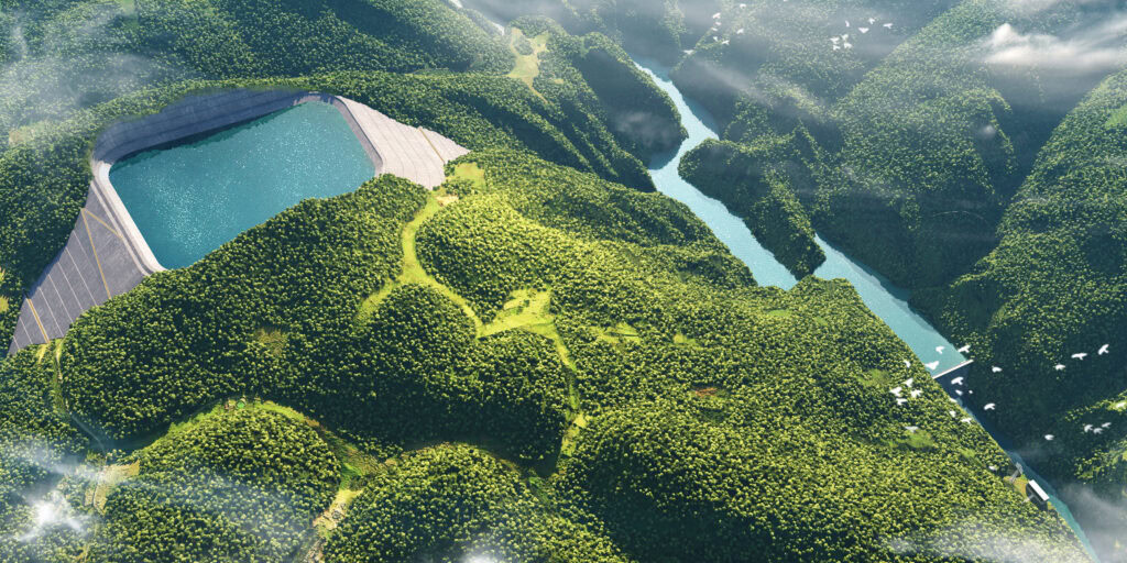 Aerial view of Caiziba pumped-storage power station in Fengjie Chongqing, nestled among forested hills, with a river winding through the valley below and scattered clouds above.
