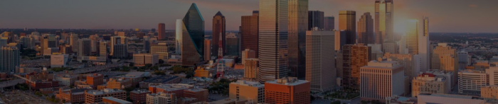Aerial view of a city skyline at sunset, featuring multiple modern high-rise buildings and a mix of architectural styles, captured beautifully in an overview video incorporating Structural WorkSuite.