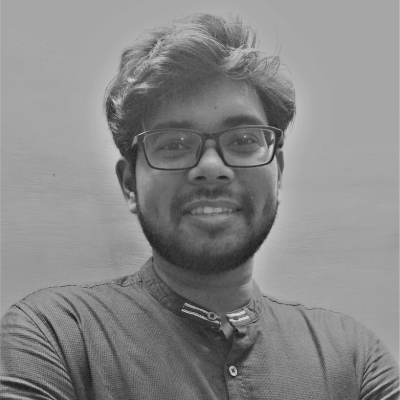 Black and white portrait of a smiling young man with glasses, wearing a collared shirt, against a plain Navisworks Workflow background.