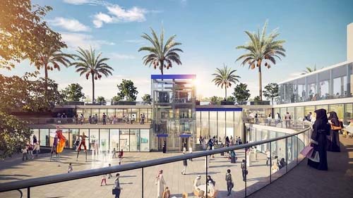 A modern, open-air shopping center featuring glass store facades and palm trees, with a central glass elevator showcasing advanced infrastructure design. Various people stroll and shop under a sunny sky, highlighting the seamless integration of MicroStation in every architectural detail.