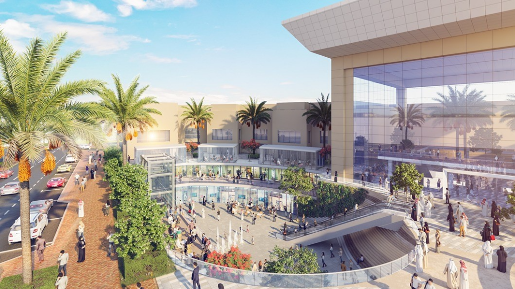 An outdoor shopping center features multiple levels, modern architecture, palm trees, and people walking. The scene, influenced by innovative transit design, includes a brick-paved path and vehicles on the left.