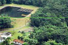 Aerial view of a water treatment facility surrounded by lush greenery, featuring a large dark water reservoir and adjacent OpenFlows infrastructure.