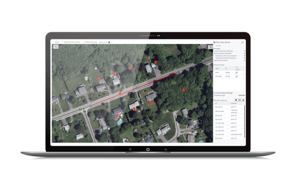Aerial map view on a laptop screen displaying a street with marked locations and data points.