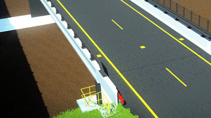 Overhead view of a modern road bridge with yellow lane markings, white side barriers, fencing, and a stairway leading down to a lower level with vegetation nearby.