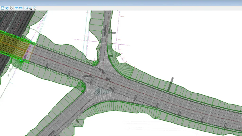 Civil engineering diagram of a roadway intersection design, showing multiple lanes, road markings, and surrounding grading contours in green.