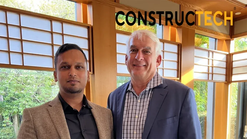 Two men wearing suits stand indoors in front of large windows with greenery outside, as the word "CONSTRUCTECH" appears in the top right corner, highlighting their focus on career development.