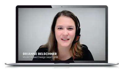 A woman with a headset speaking in a video call, displayed on a laptop screen. The caption on the screen reads, "BRIANNE BELSCHNER, Model-Based Design Lead | VHB." This user testimonial highlights her work on OpenSite projects.