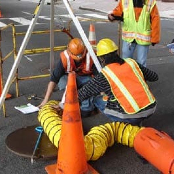 people working in manhole