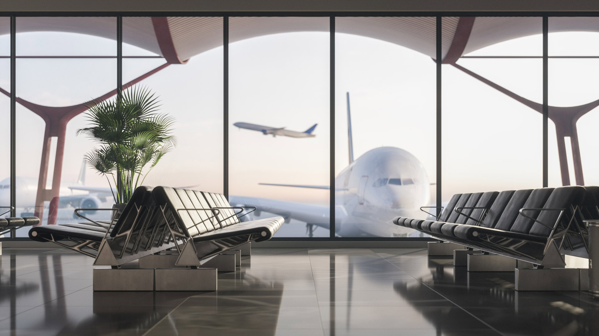 The empty airport terminal, showcasing rows of black seating and large windows revealing a stationary airplane and another taking off, highlights the new era of Indian aviation. A potted plant graces the left side.