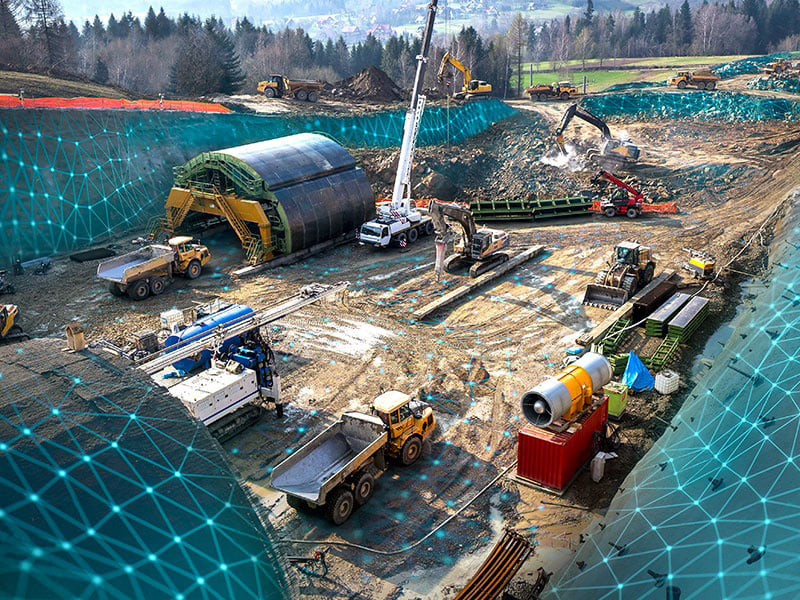 a construction site with various large construction equipment and a digital overlay of blue connected dots overlayed on the image