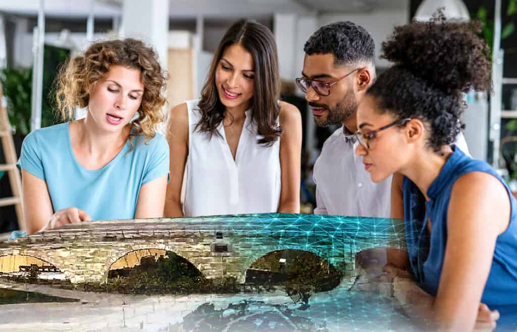 four people looking at digital twin of a bridge
