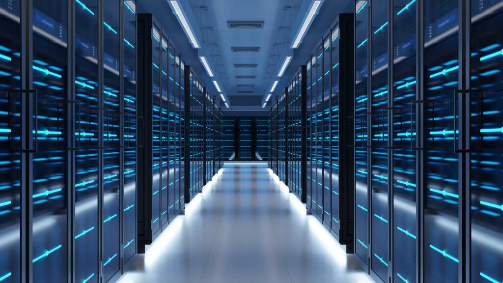 A modern data center hallway with rows of server racks illuminated by blue LED lights on both sides.