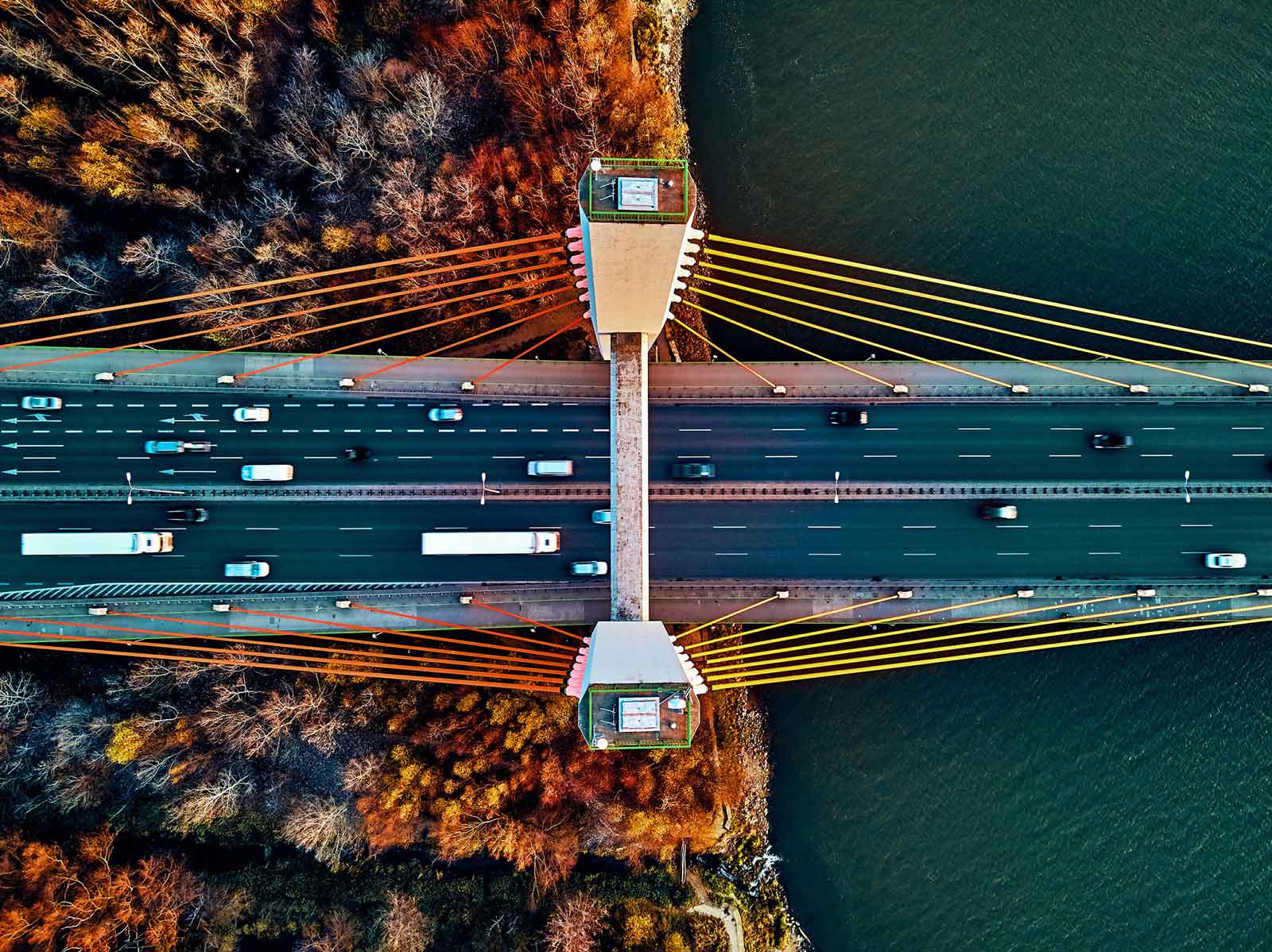 an aerial view of a bridge going a river
