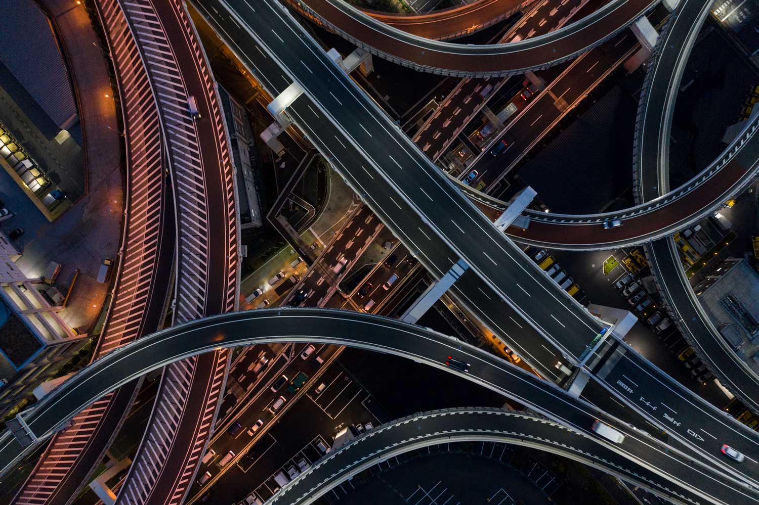 arial shot of highway interchange network of roads and highways