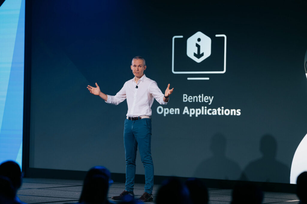 A man giving a presentation on open applications.