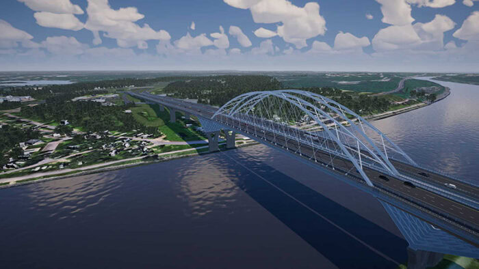 A large steel arch bridge spans a wide river, with vehicles traveling in both directions and green landscape on either side under a partly cloudy sky—an ideal scene for creating digital twins using 3D geospatial data.
