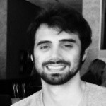 Black and white photo of a young man with a beard smiling at the camera during an "Efficient Design Workflows" webinar.