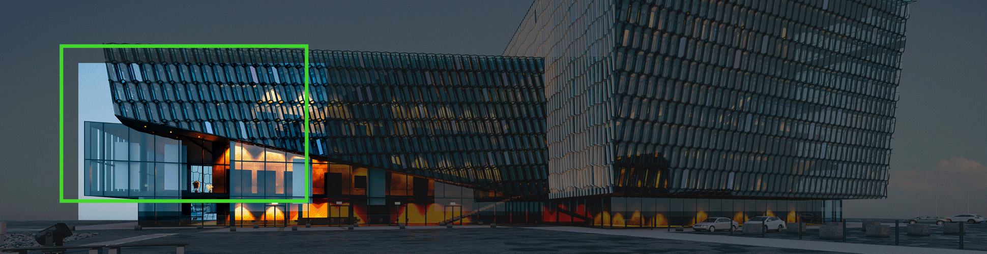 A modern glass and steel building with irregular, overlapping rectangular structures, illuminated by lights from within and embodying cutting-edge design, stands against a dusky sky—truly making its mark on the landscape.