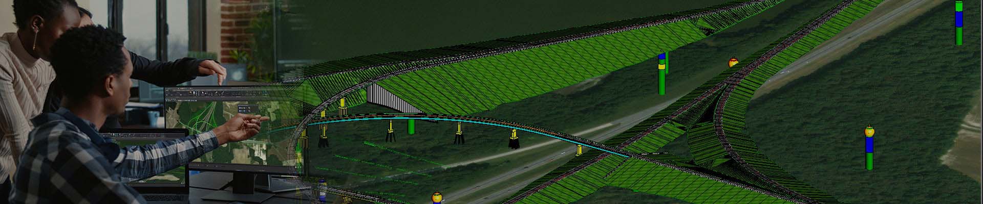 Three individuals analyze digital maps and infrastructure planning on computer monitors, overlaid with a 3D model of a green, hilly terrain featuring various pathways and colored markers. For more insights, download our comprehensive e-book. Thank you for your interest!