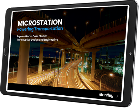         Tablet displaying the cover of the MicroStation eBook titled "Powering Transportation," featuring a nighttime highway scene with light trails, emphasizing innovative design and engineering case studies.
