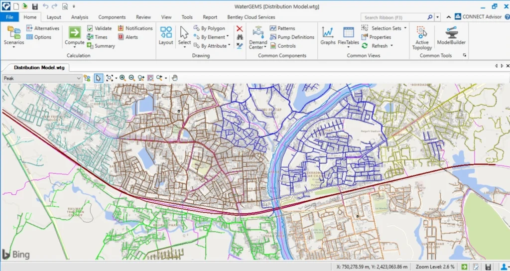 A screenshot of the OpenFlows WaterGEMS water distribution system modeling software overlaid on a map, indicating the layout of pipes and infrastructure across an urban area.