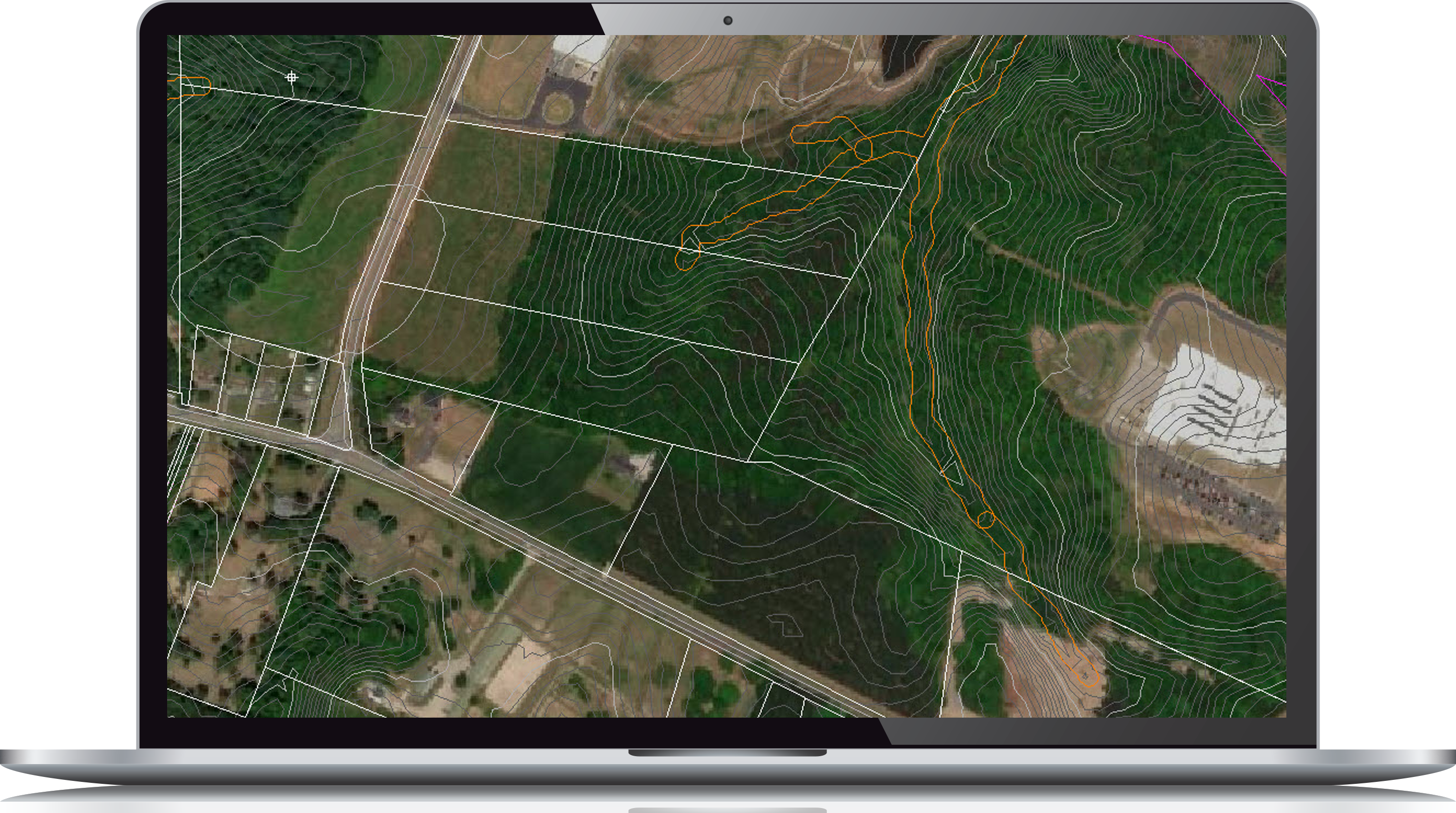 Aerial view of a laptop displaying topographic map with contour lines and boundaries for site development over farmland and a road.