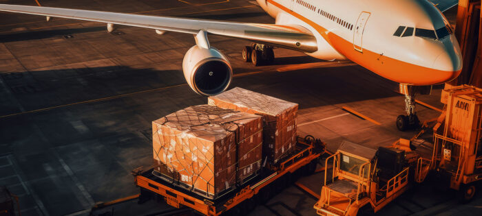 Cargo Plane Soaring Through Blue Skies with Containers Secured in Its Belly, Transporting Air Freight Swiftly Across Continents to Meet Global Delivery Demands