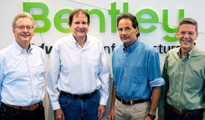 Bentley brothers gathered in front of the Bentley Logo