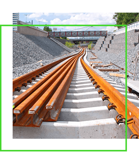 An image of a train track with a green frame.