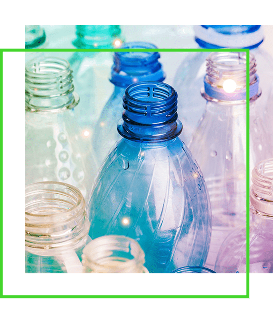 A group of plastic bottles in a green frame.