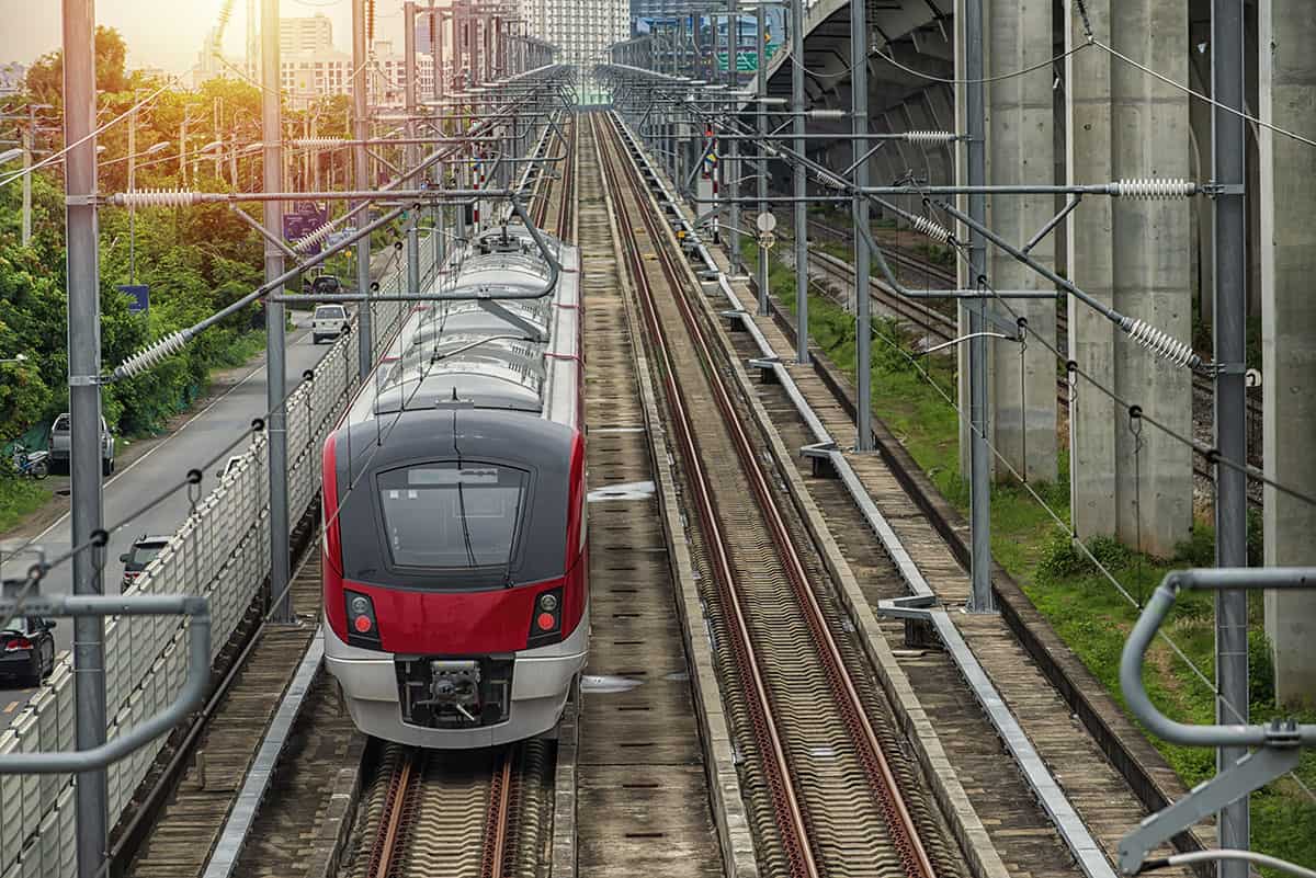 Red train approaching stop at a train station