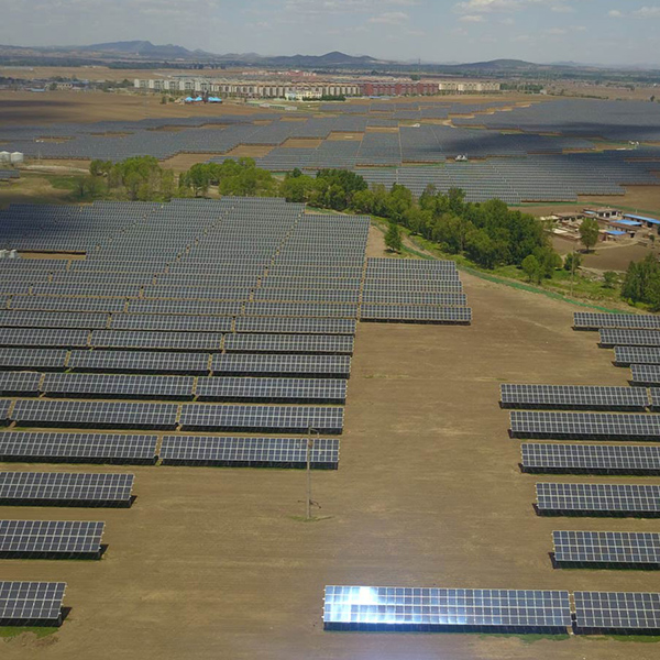 An aerial view of a solar panel field.