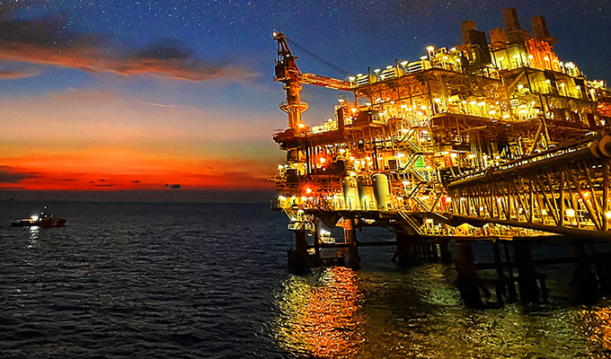 A large oil rig in the ocean.