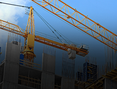 Construction cranes on a construction site.