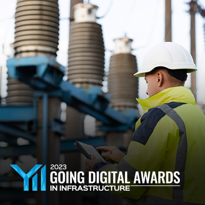 worker in front of power grid with YII 2023 logo on top of graphics