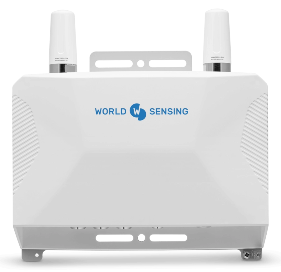 A white electronic device labeled "World Sensing" with two upright antennas on top, featuring ventilation grilles on the sides.