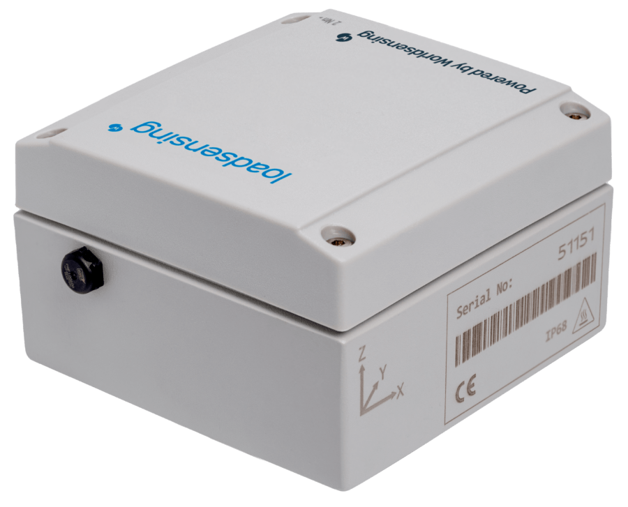A white, rectangular electronic device with a barcode, serial number, and labeled "loadsensing" and "Powered by Worldsensing" on the casing.