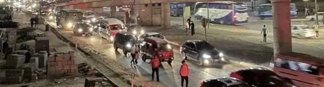 Nighttime photo showing heavy traffic congestion on a street in Cairo, representing the mobility challenges that were analyzed for the Cairo Metro Line 4 project.